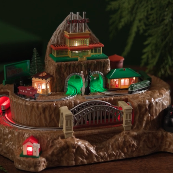 A Keepsake table decoration celebrating the 125th anniversary of Lionel trains; the figurine takes the shape of a mountain top with trains and tracks circling it, with lighted bridges and tunnels.